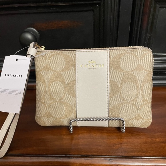 Coach Handbags - Coach Beige and Cream Wristlet
